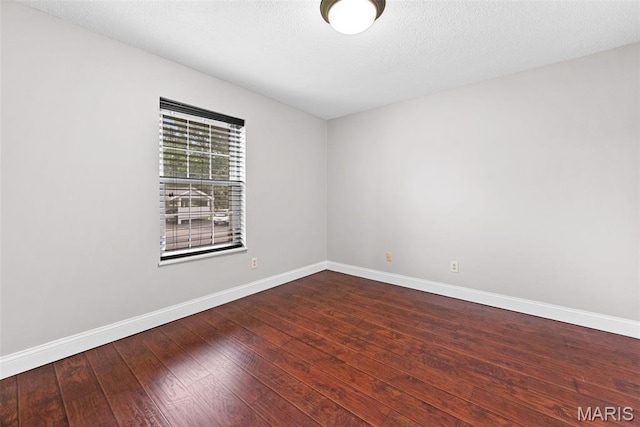 2 Berview Cir Unit H, Saint Louis, MO 63129 - unfurnished room with baseboards and hardwood / wood-style flooring