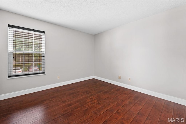 2 Berview Cir Unit H, Saint Louis, MO 63129 - unfurnished room with dark wood finished floors and a textured ceiling