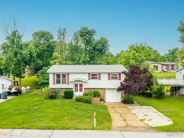 1907 Lone Pine Dr, Arnold, MO 63010 - split foyer home with driveway, an attached garage, brick siding, and a front yard