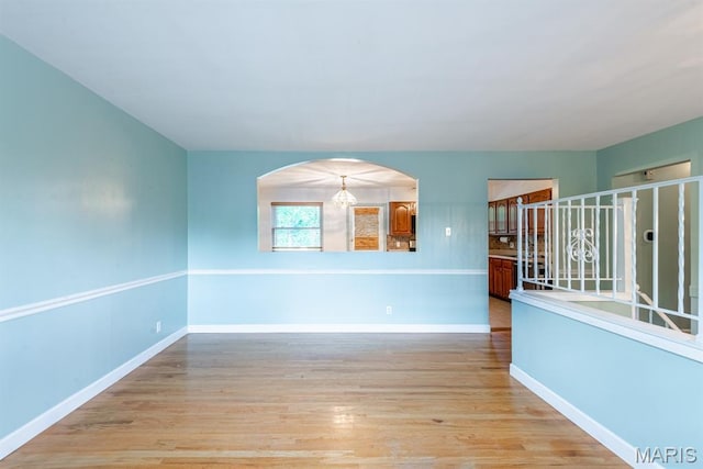 1907 Lone Pine Dr, Arnold, MO 63010 - spare room with light wood finished floors and arched walkways