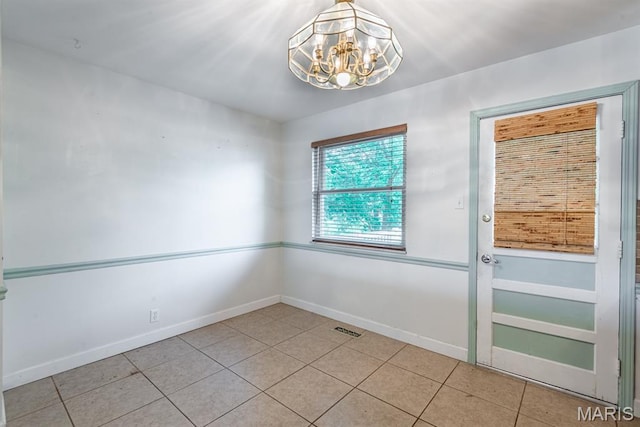 1907 Lone Pine Dr, Arnold, MO 63010 - empty room with a chandelier and tile patterned flooring