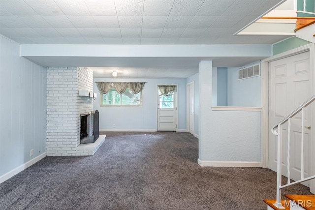 1907 Lone Pine Dr, Arnold, MO 63010 - unfurnished living room with carpet flooring, a brick fireplace, and stairs