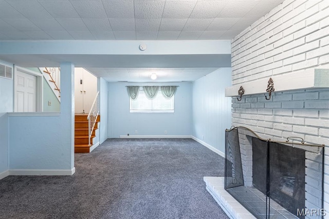 1907 Lone Pine Dr, Arnold, MO 63010 - unfurnished living room with carpet flooring, stairway, and a brick fireplace