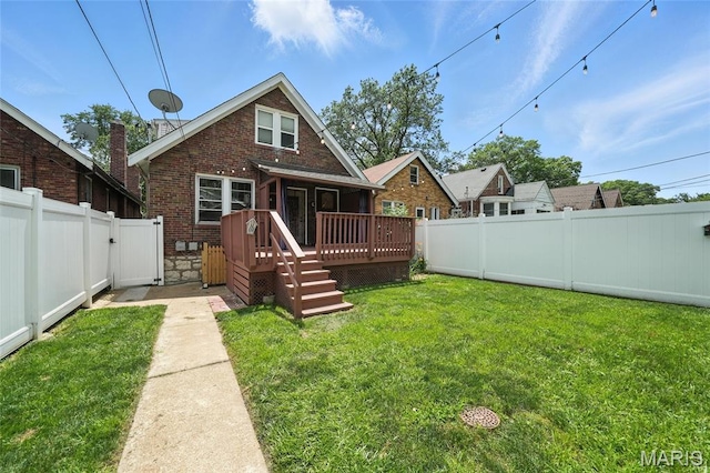 5743 Delor St, Saint Louis, MO 63109 - rear view of house featuring a fenced backyard, a deck, brick siding, and a gate