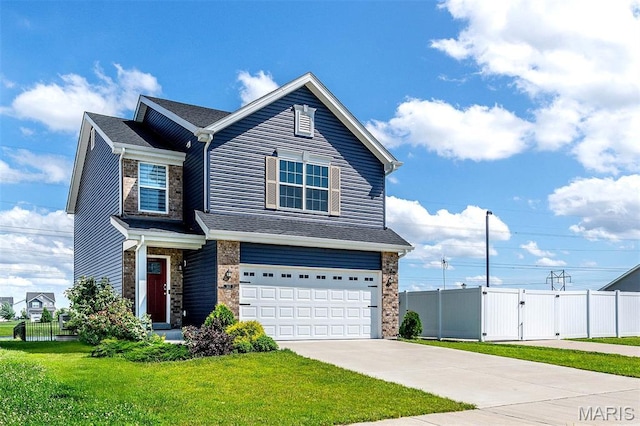 502 Summer Glen Ln, Saint Charles, MO 63301 - view of front facade with an attached garage, concrete driveway, a gate, and stone siding