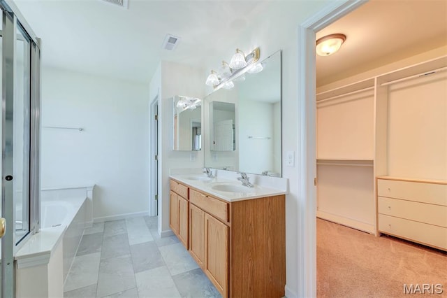 502 Summer Glen Ln, Saint Charles, MO 63301 - full bathroom with a garden tub, double vanity, and a shower with shower door