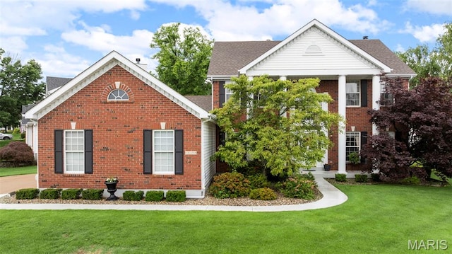 16368 Cherry Orchard Dr, Grover, MO 63040 - greek revival inspired property with brick siding, a front yard, and a shingled roof