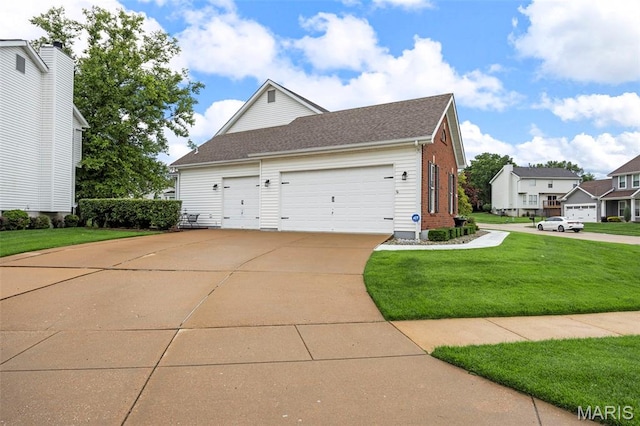 16368 Cherry Orchard Dr, Grover, MO 63040 - view of property exterior featuring a lawn, concrete driveway, a garage, and a shingled roof