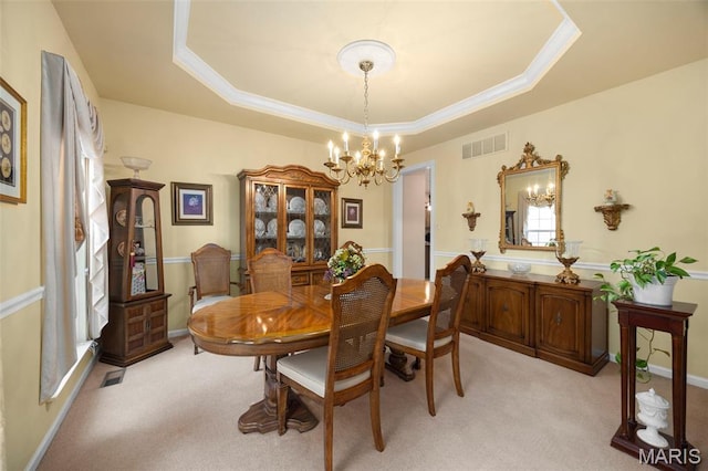 16368 Cherry Orchard Dr, Grover, MO 63040 - dining room featuring a chandelier, a raised ceiling, light carpet, and crown molding