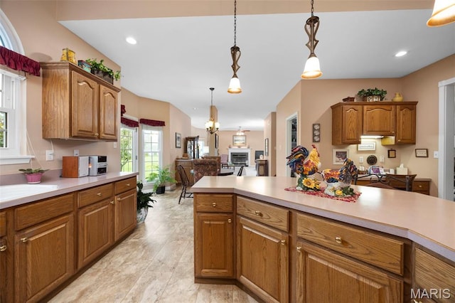 16368 Cherry Orchard Dr, Grover, MO 63040 - kitchen featuring light countertops, decorative light fixtures, brown cabinets, and recessed lighting