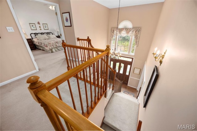 16368 Cherry Orchard Dr, Grover, MO 63040 - stairs with a chandelier, carpet flooring, and a towering ceiling