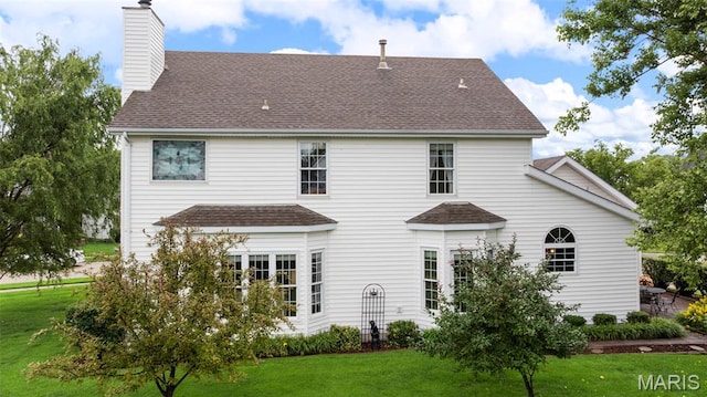 16368 Cherry Orchard Dr, Grover, MO 63040 - back of property featuring a yard, a chimney, and a shingled roof