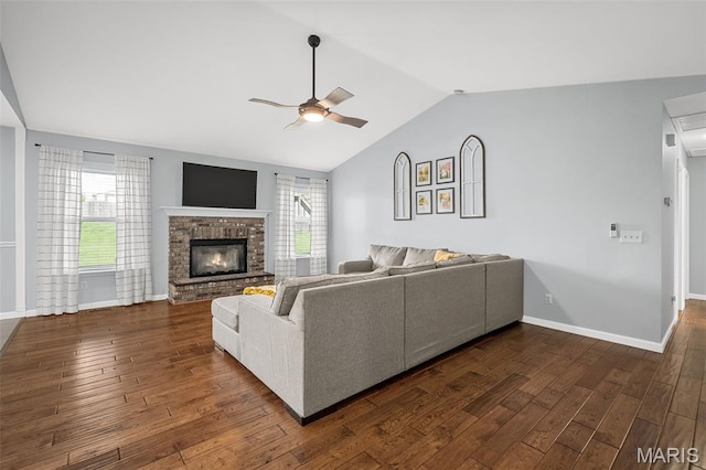 2607 Riley Paul Ct, Ofallon, MO 63368 - living room featuring ceiling fan, dark wood finished floors, vaulted ceiling, and a fireplace