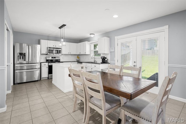 2607 Riley Paul Ct, Ofallon, MO 63368 - dining area featuring light tile patterned floors, french doors, and recessed lighting