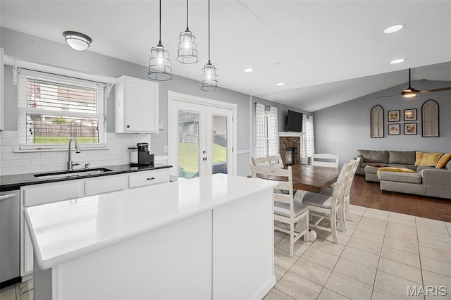 2607 Riley Paul Ct, Ofallon, MO 63368 - kitchen featuring french doors, recessed lighting, open floor plan, white cabinetry, and lofted ceiling