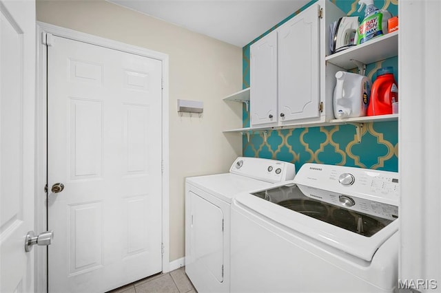 2607 Riley Paul Ct, Ofallon, MO 63368 - laundry area with washing machine and clothes dryer, cabinet space, and light tile patterned floors