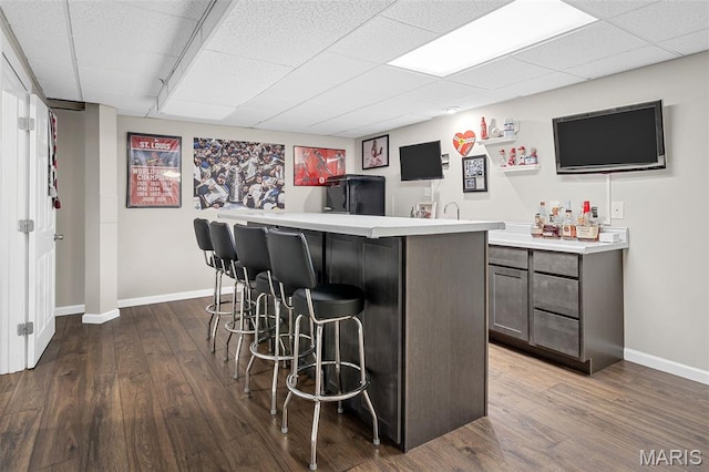 2607 Riley Paul Ct, Ofallon, MO 63368 - indoor bar with a drop ceiling and dark wood-type flooring
