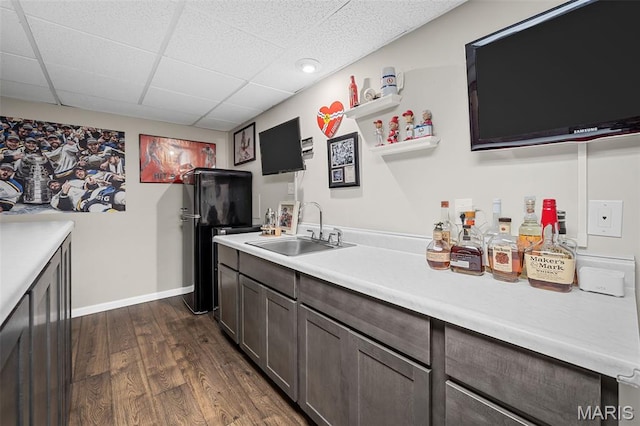 2607 Riley Paul Ct, Ofallon, MO 63368 - kitchen featuring freestanding refrigerator, a drop ceiling, light countertops, dark wood-style floors, and dark brown cabinetry
