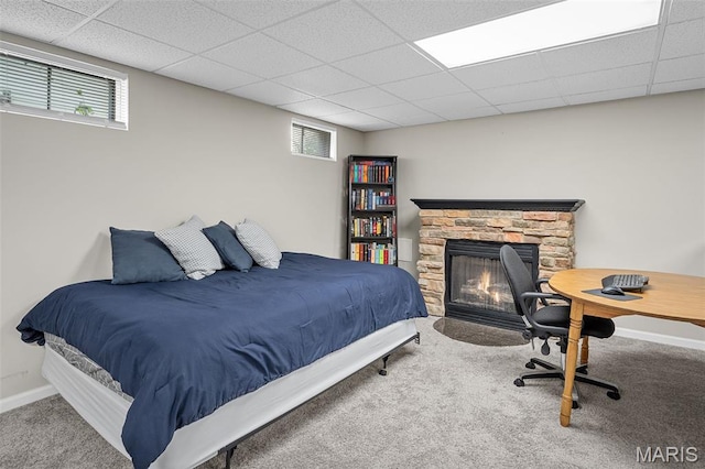 2607 Riley Paul Ct, Ofallon, MO 63368 - bedroom featuring carpet floors, multiple windows, a stone fireplace, and a paneled ceiling