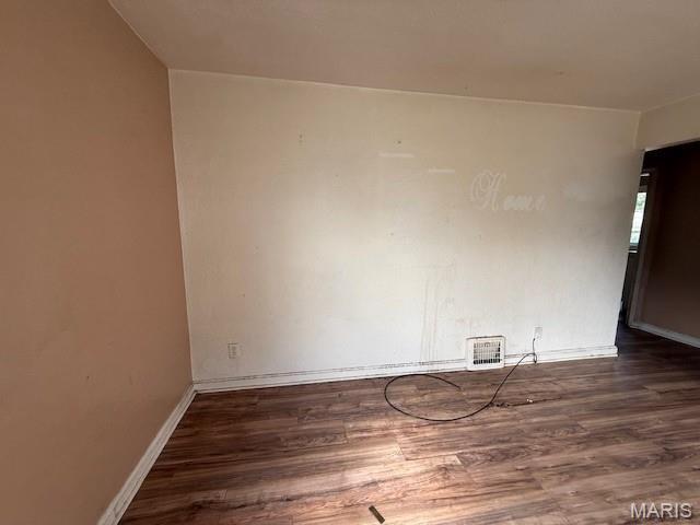 7446 Calvin Ave, Country Club Hills, MO 63136 - unfurnished room featuring wood finished floors and baseboards