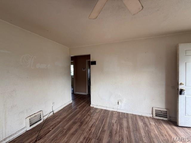 7446 Calvin Ave, Country Club Hills, MO 63136 - spare room with wood finished floors and baseboards