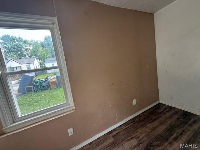 7446 Calvin Ave, Country Club Hills, MO 63136 - empty room featuring wood finished floors and baseboards