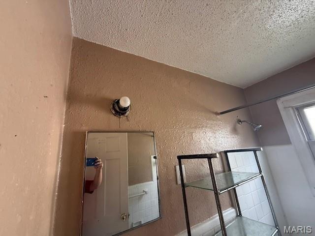 7446 Calvin Ave, Country Club Hills, MO 63136 - bathroom view of a textured ceiling and a textured wall