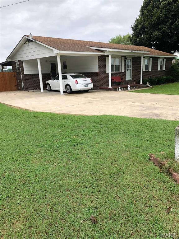 746 State Highway P, New Madrid, MO 63869 - ranch-style house featuring brick siding, a carport, and driveway