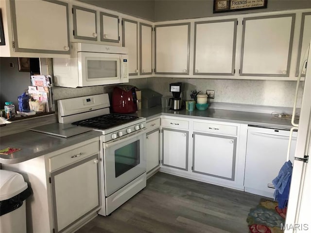 746 State Highway P, New Madrid, MO 63869 - kitchen with white appliances, dark wood-style flooring, and white cabinets