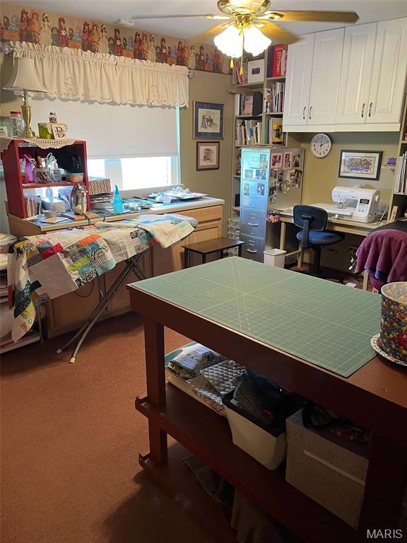 746 State Highway P, New Madrid, MO 63869 - office area with a ceiling fan, carpet, and built in study area