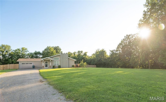16533 Chateau Ln, Dexter, MO 63841 - view of front of house featuring gravel driveway and a garage