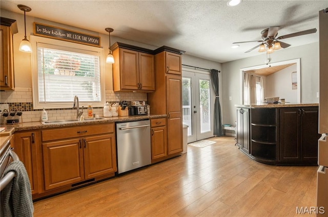16533 Chateau Ln, Dexter, MO 63841 - kitchen featuring dishwasher, a ceiling fan, decorative backsplash, brown cabinetry, and recessed lighting