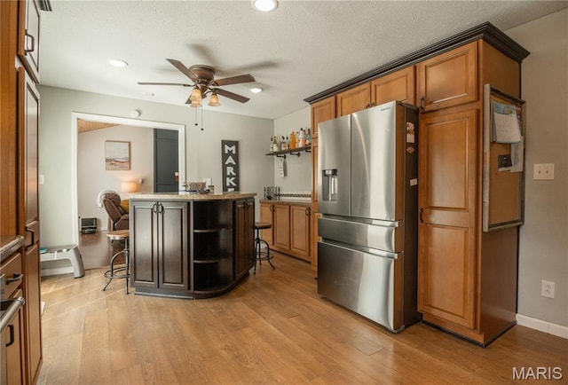 16533 Chateau Ln, Dexter, MO 63841 - kitchen featuring stainless steel refrigerator with ice dispenser, open shelves, a ceiling fan, light wood-type flooring, and recessed lighting