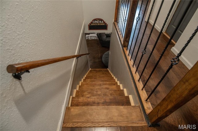 16533 Chateau Ln, Dexter, MO 63841 - staircase with a textured wall and wood finished floors