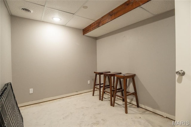 16533 Chateau Ln, Dexter, MO 63841 - empty room featuring concrete flooring and a drop ceiling