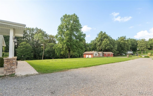 16533 Chateau Ln, Dexter, MO 63841 - view of grassy yard with view of wooded area