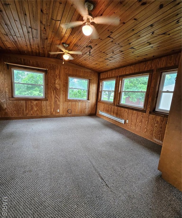 1504 Dean Ave, Hannibal, MO 63401 - carpeted spare room with a baseboard radiator, wood ceiling, wood walls, and a ceiling fan