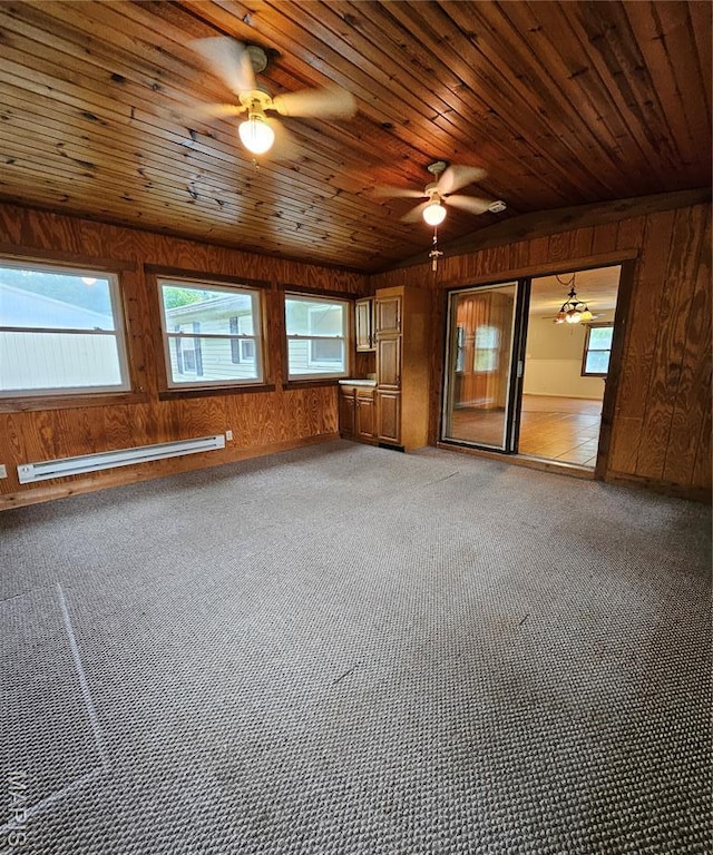 1504 Dean Ave, Hannibal, MO 63401 - unfurnished room featuring a baseboard radiator, ceiling fan, carpet, wooden walls, and wooden ceiling