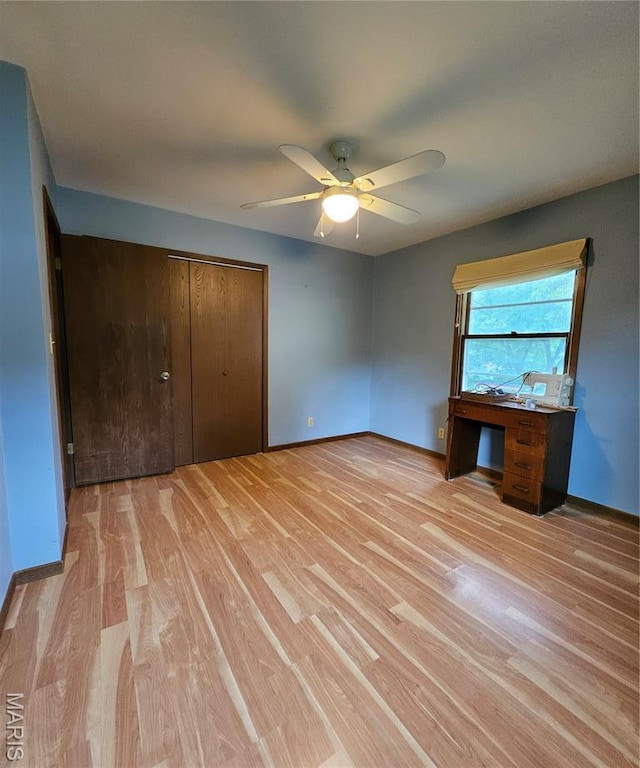 1504 Dean Ave, Hannibal, MO 63401 - unfurnished bedroom with light wood-style flooring, a closet, and ceiling fan