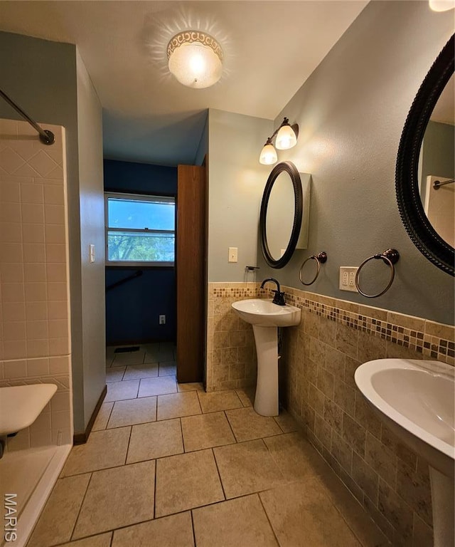 1504 Dean Ave, Hannibal, MO 63401 - full bath with tile walls, a shower, tile patterned floors, and a wainscoted wall