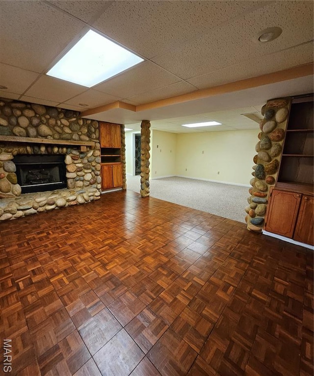 1504 Dean Ave, Hannibal, MO 63401 - unfurnished living room featuring a fireplace, carpet, and a paneled ceiling