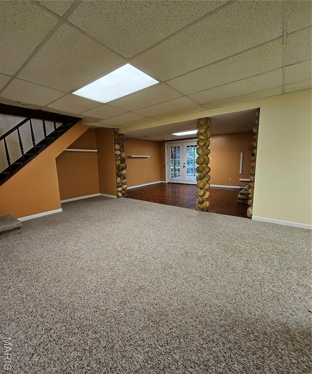 1504 Dean Ave, Hannibal, MO 63401 - finished basement with carpet flooring, a paneled ceiling, and stairs