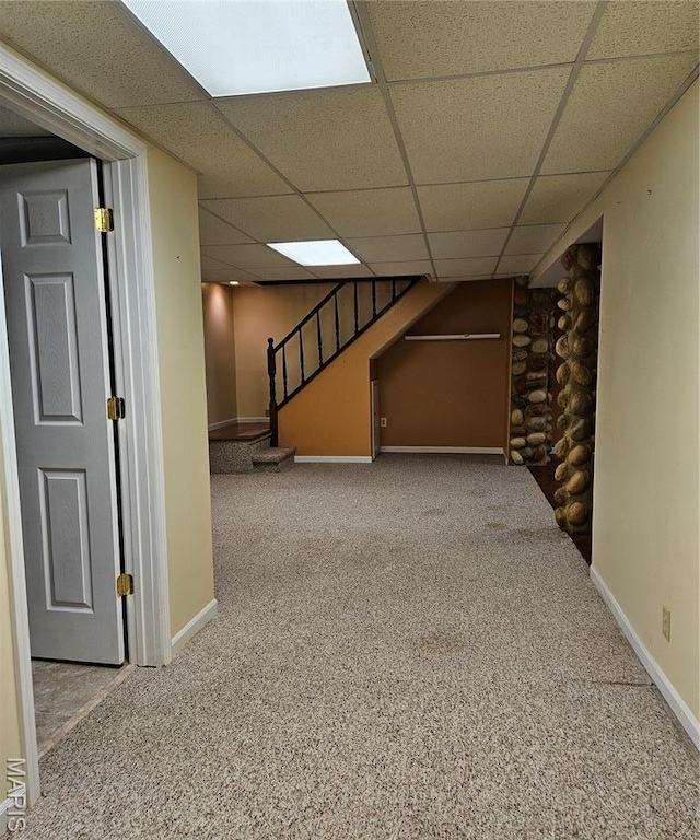 1504 Dean Ave, Hannibal, MO 63401 - finished below grade area featuring carpet, a paneled ceiling, and stairs