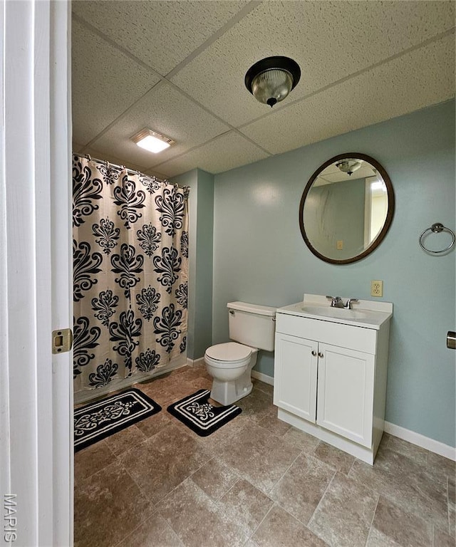 1504 Dean Ave, Hannibal, MO 63401 - full bathroom featuring a paneled ceiling, vanity, a shower with curtain, and stone finish floors