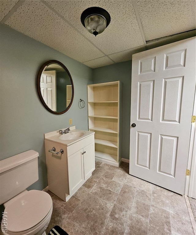 1504 Dean Ave, Hannibal, MO 63401 - bathroom with a drop ceiling, vanity, and stone finish flooring