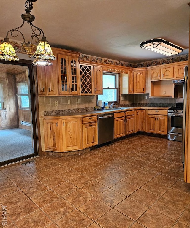 1504 Dean Ave, Hannibal, MO 63401 - kitchen featuring stainless steel appliances, dark countertops, and healthy amount of natural light