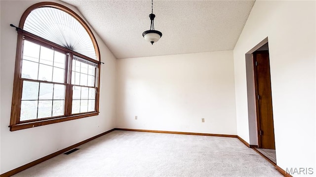 200 April Dr, Saint Robert, MO 65584 - spare room featuring light colored carpet and a textured ceiling