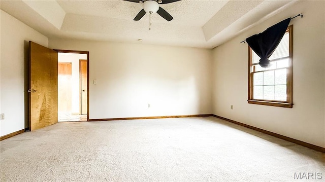 200 April Dr, Saint Robert, MO 65584 - carpeted empty room with a raised ceiling, ceiling fan, and a textured ceiling