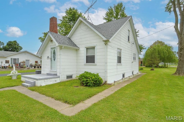 307 S S St, Smithton, IL 62285 - view of home's exterior with roof with shingles, a yard, and a chimney