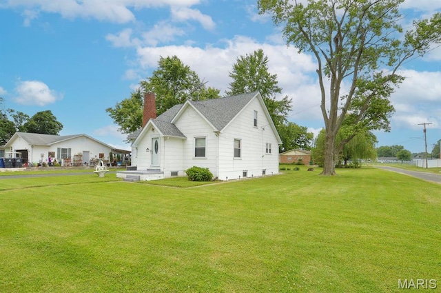307 S S St, Smithton, IL 62285 - view of side of property with a chimney and a yard